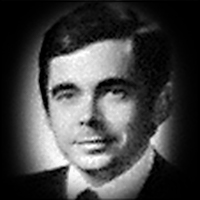 A headshot of John Roxborough Smith