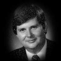A headshot of Alan M. Robinson