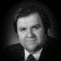 A headshot of René L. Piché