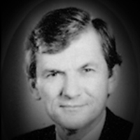 A headshot of Michael Charles Ray