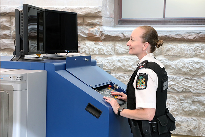 officer operating screen equipment