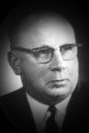 A headshot of Alex Carruthers.