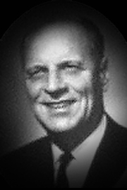 A headshot of Allister Johnston.